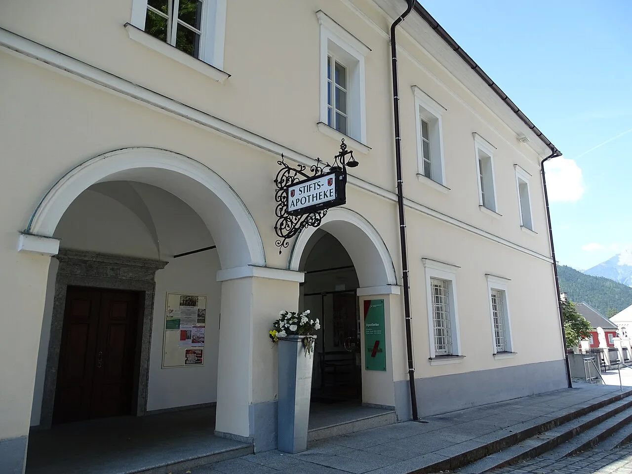Arched entrance of the abbey pharmacy on the grounds of Admont Abbey.