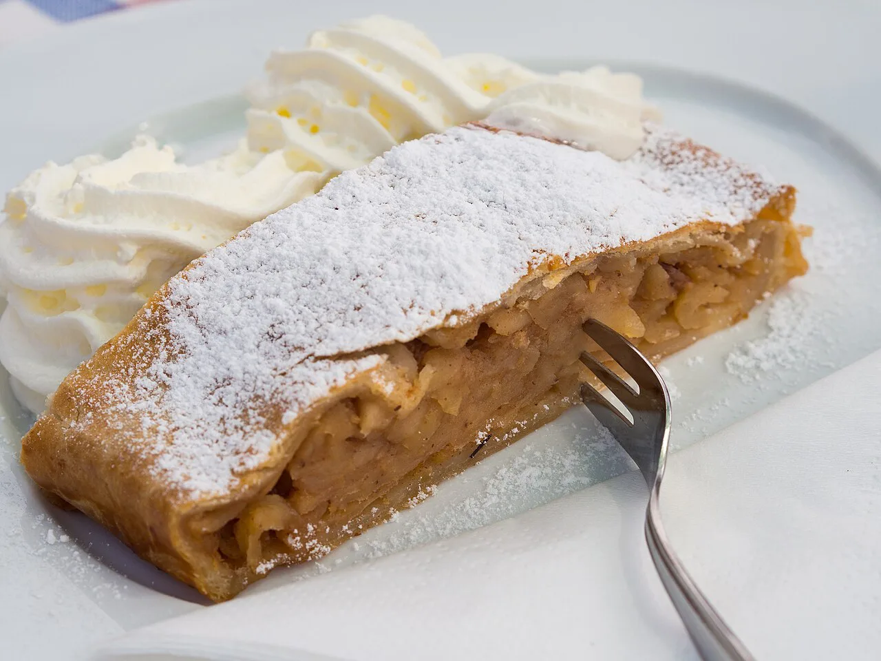 Apple strudel with whipped cream at the Gaislachalm above Sölden, Tyrol.