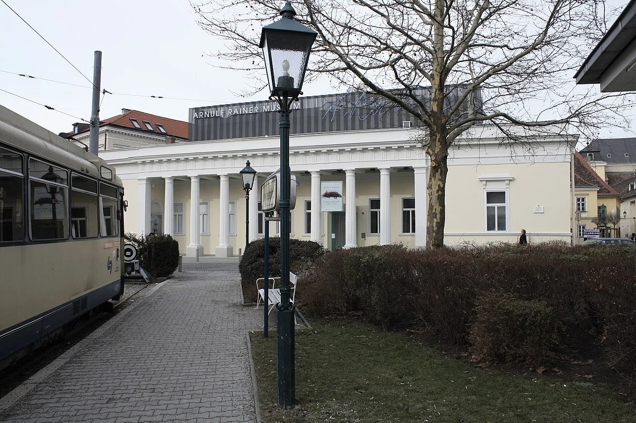 The colonnaded Arnulf Rainer Museum seen from a tram stop in Baden.