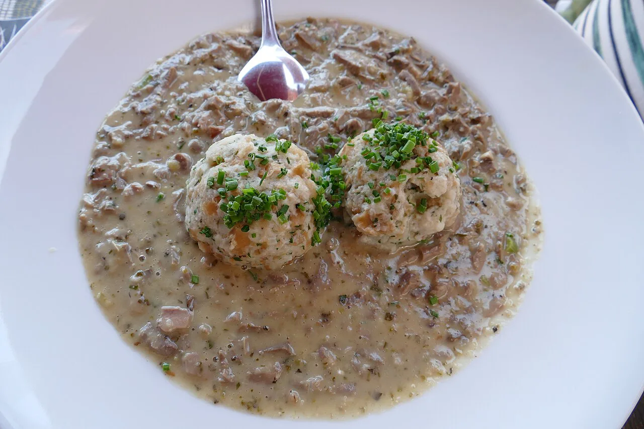 Kalbsbeuschel, a veal ragout, served with bread dumplings and chopped parsley.