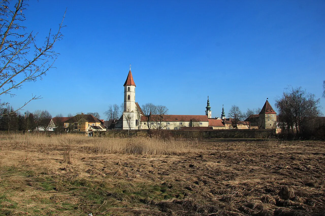 Bad Radkersburg's town wall and church tower seen from the spa park.