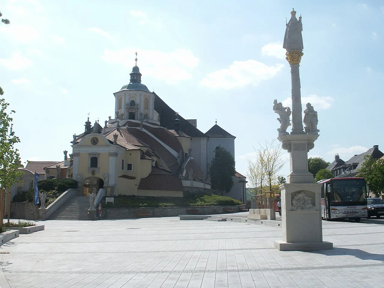 The Bergkirche in Eisenstadt seen across the square with its Marian column.