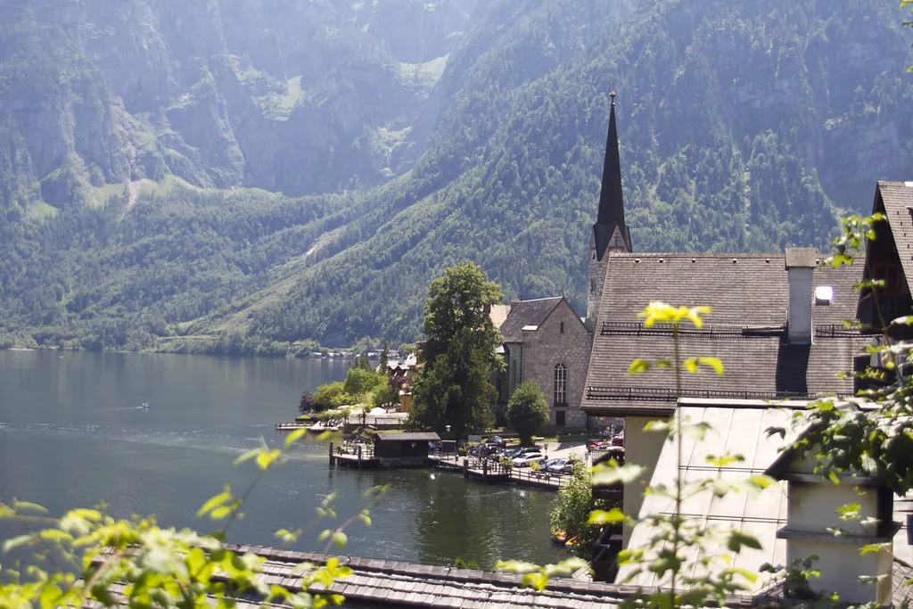 Hallstatt's church and lakeside houses below the mountains.