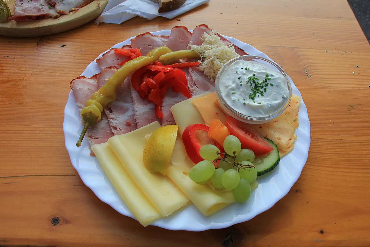 A Brettljause plate of meats, cheese and spread at a Lower Austrian cider tavern.