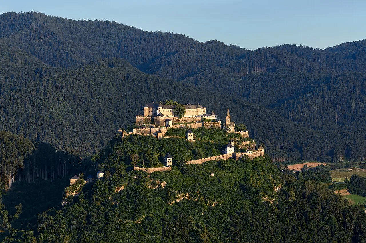 Hochosterwitz Castle seen from the north above wooded hills.