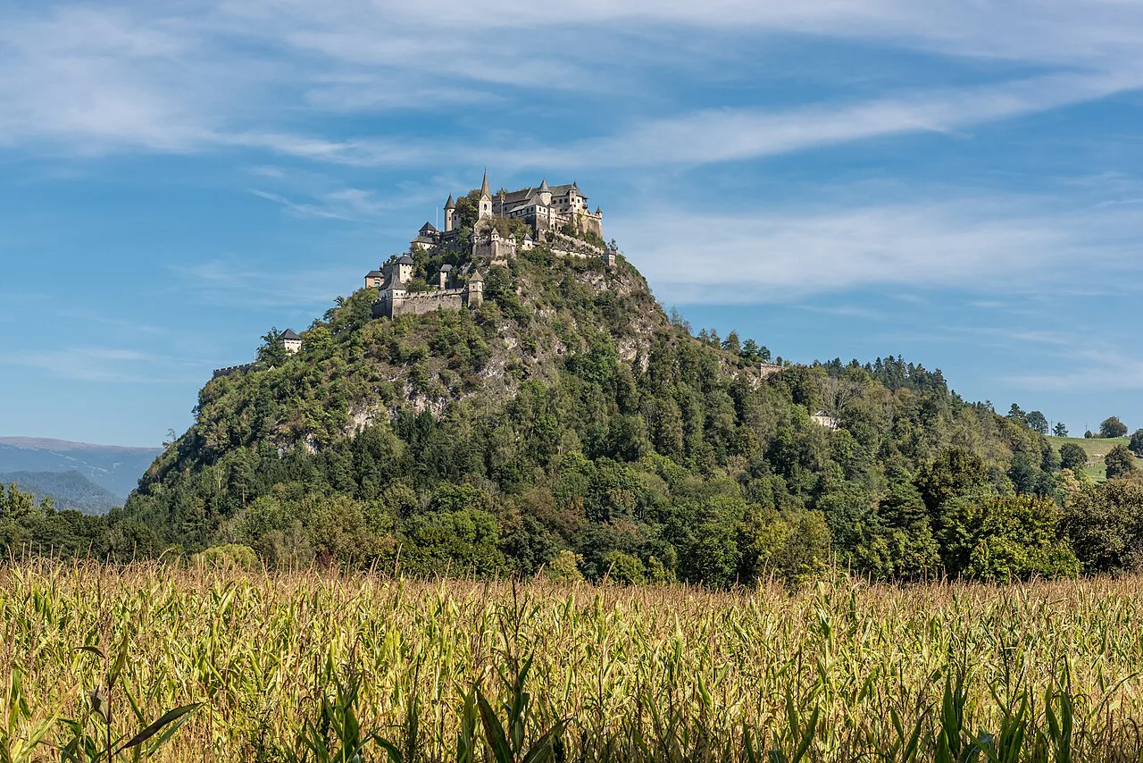 The west side of Hochosterwitz Castle rising above farm fields.