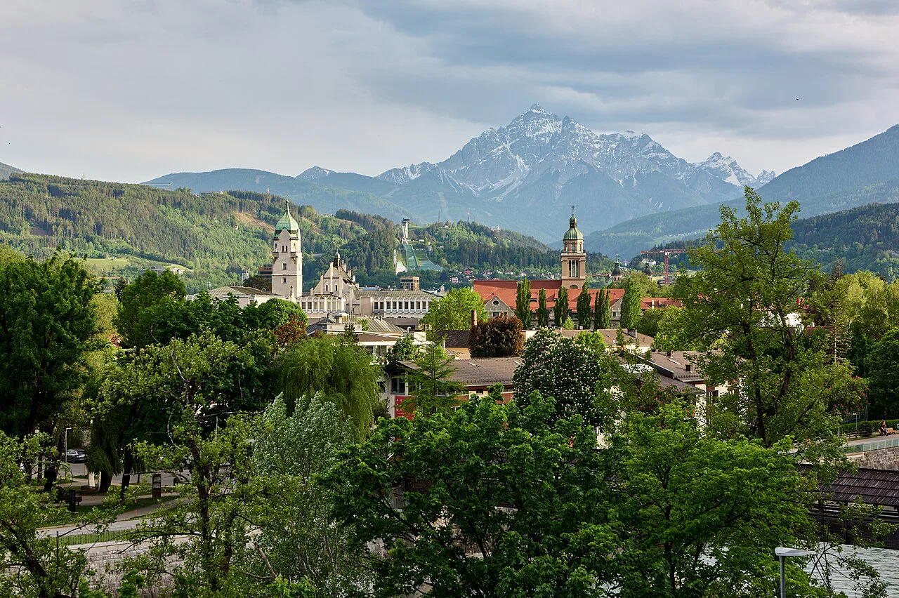 Church towers rising above Innsbruck, seen from the Heinrich-Süß-Weg in Hötting.