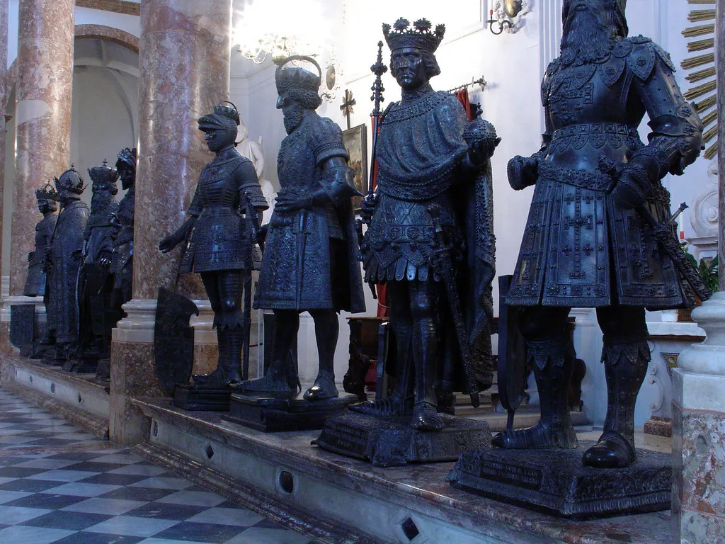 Venue view: interior of the Hofkirche in Innsbruck, showing Maximilian's cenotaph and bronze figures.