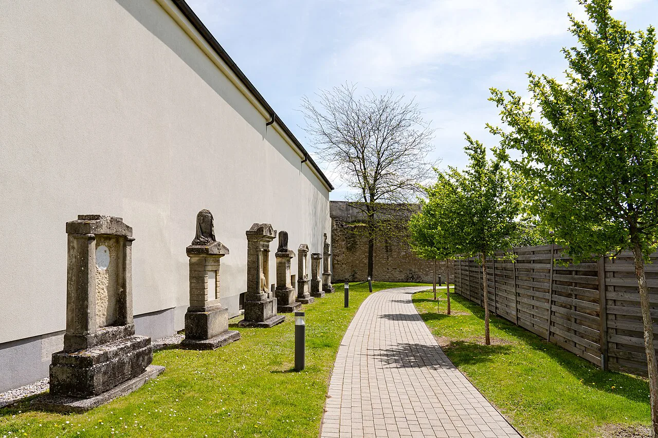 Old gravestones along the wall behind St Martin's Cathedral in Eisenstadt.