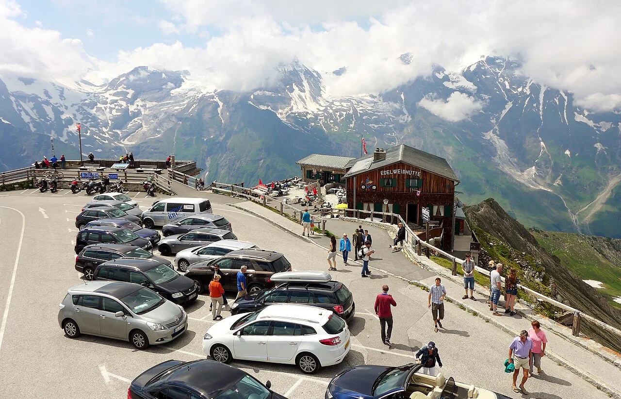 The Edelweißspitze car park and hut seen from the lookout tower, with High Tauern peaks behind.