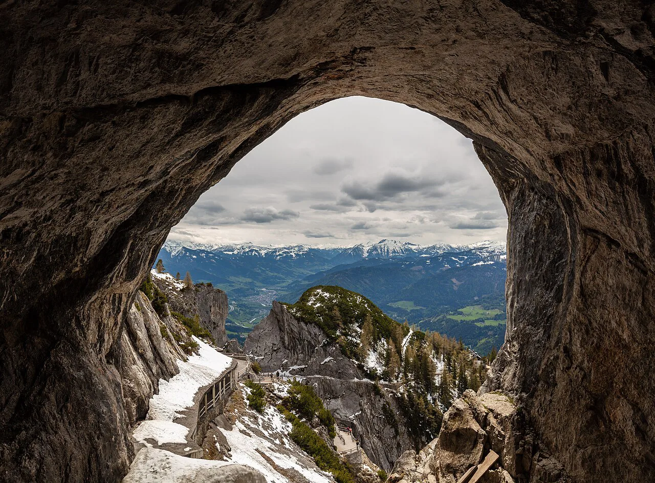 Looking out from the entrance of the Eisriesenwelt ice cave over the Tennen Mountains.