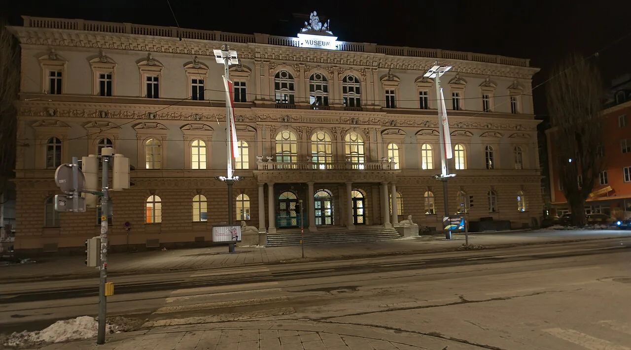 The Tyrolean State Museum Ferdinandeum on Museumstraße in Innsbruck at night.