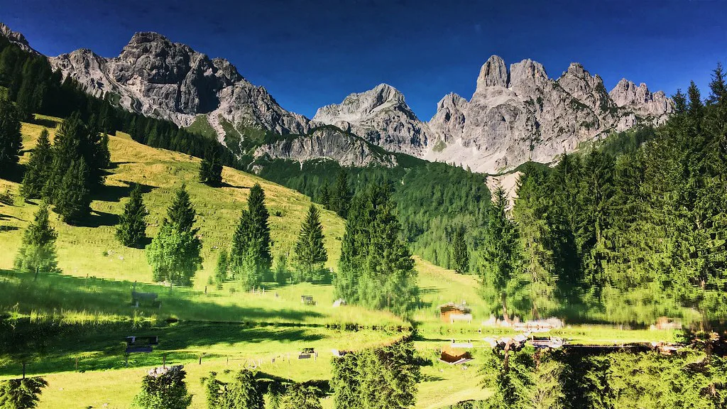 The Bischofsmütze peak reflected in a small lake near Filzmoos.