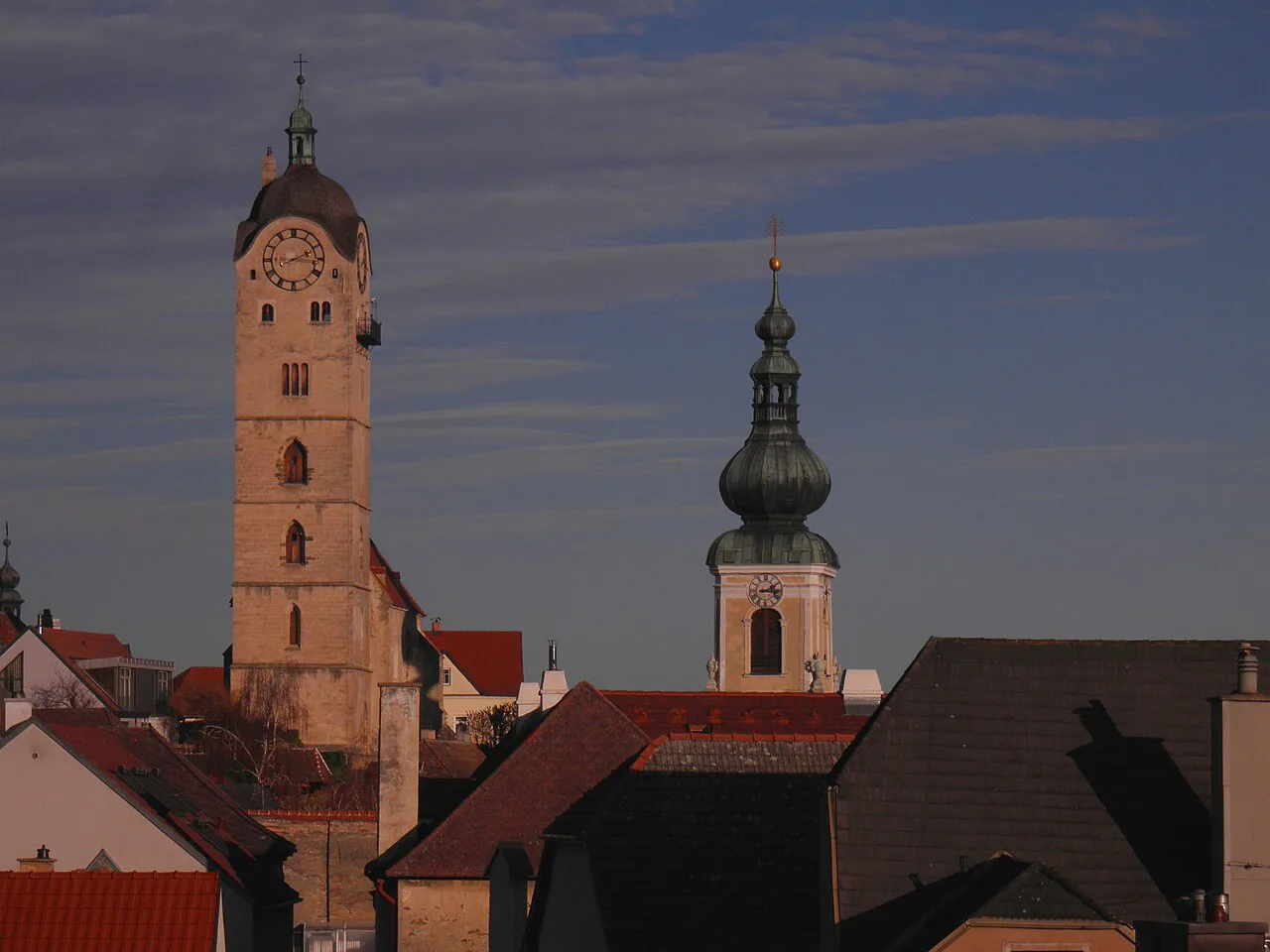 The towers of the Frauenbergkirche and St Nicholas's Church in Stein at dusk.