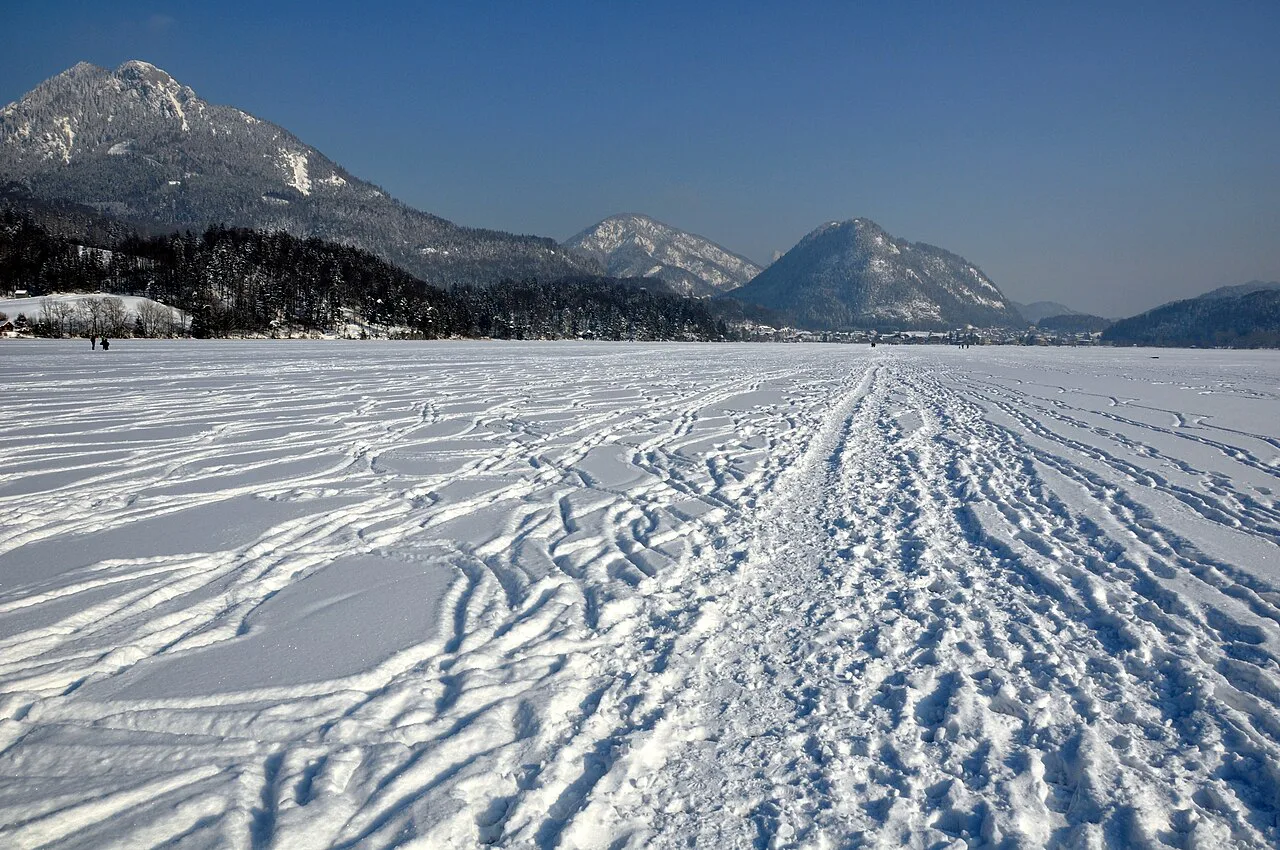 The frozen, snow-covered Fuschlsee in winter.