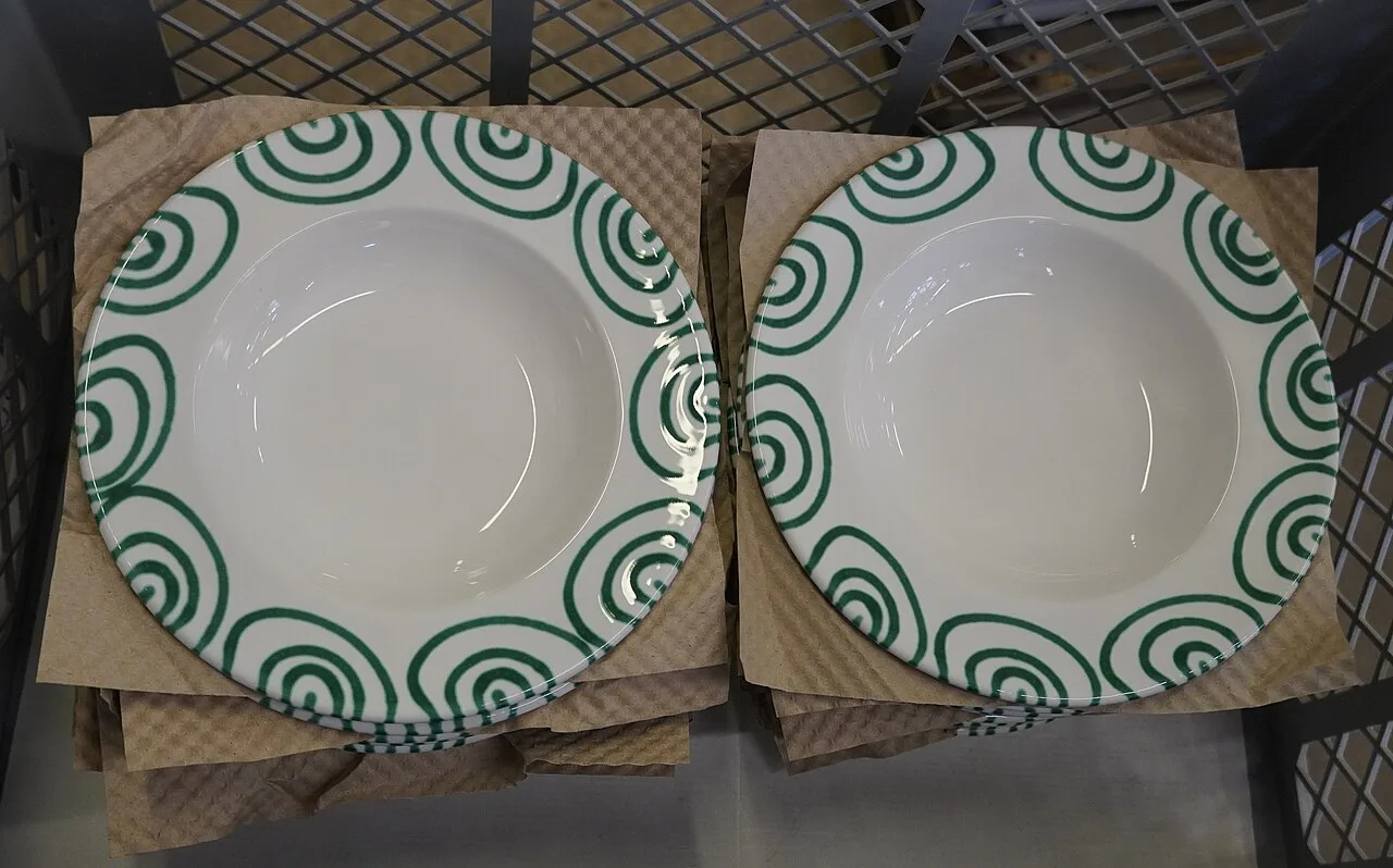 Green flamed-pattern plates made at the Gmundner Keramik manufactory.