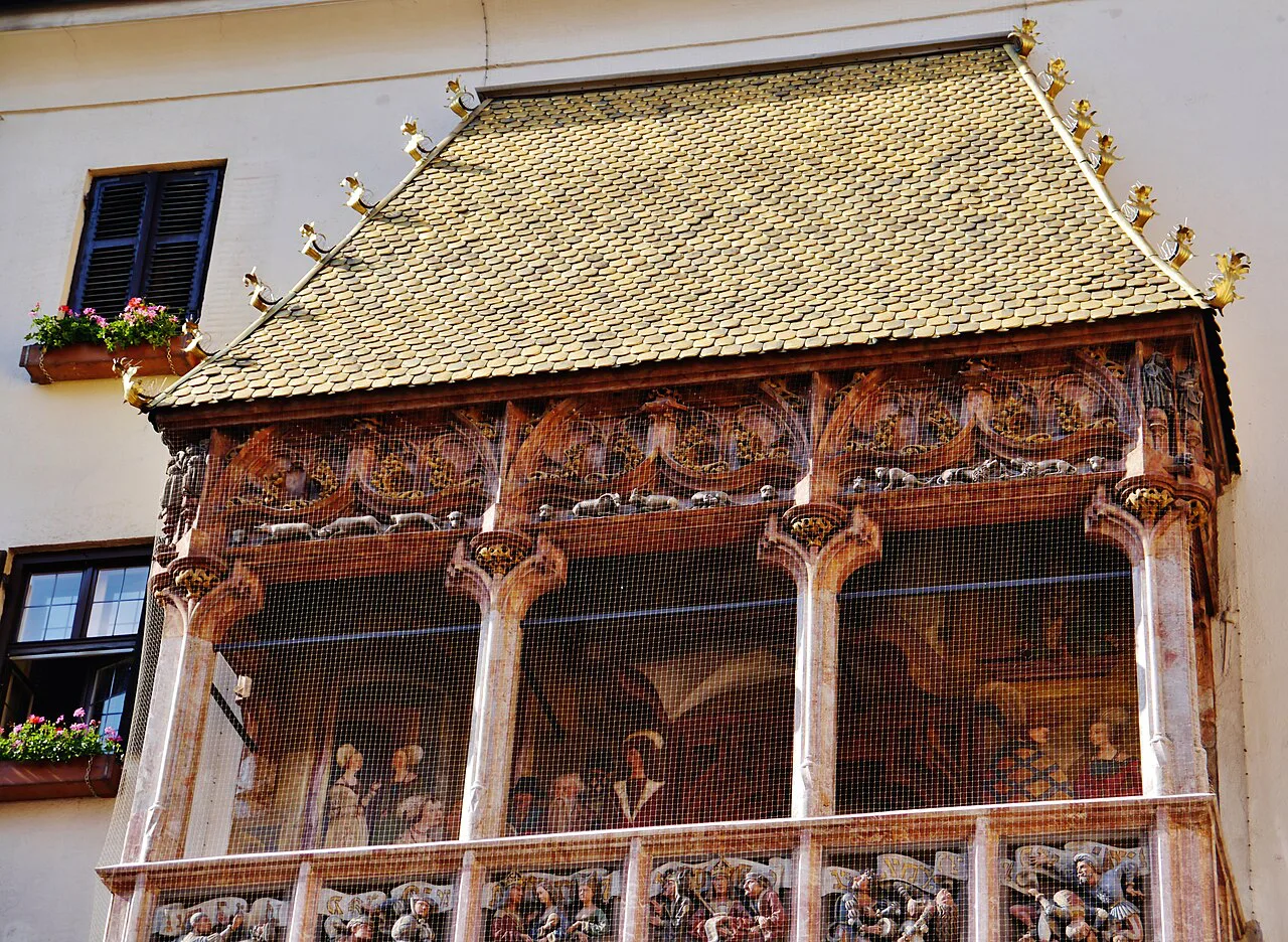 Close-up of the gilded tiles and carved balcony of Innsbruck's Golden Roof.