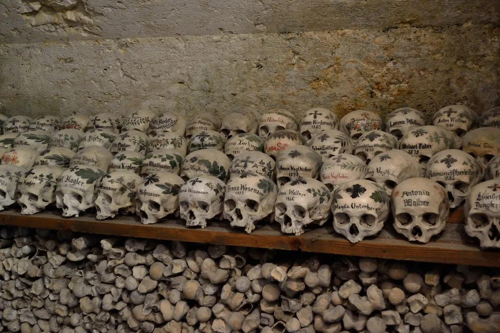 Painted skulls in the charnel house beside Hallstatt's Catholic parish church.