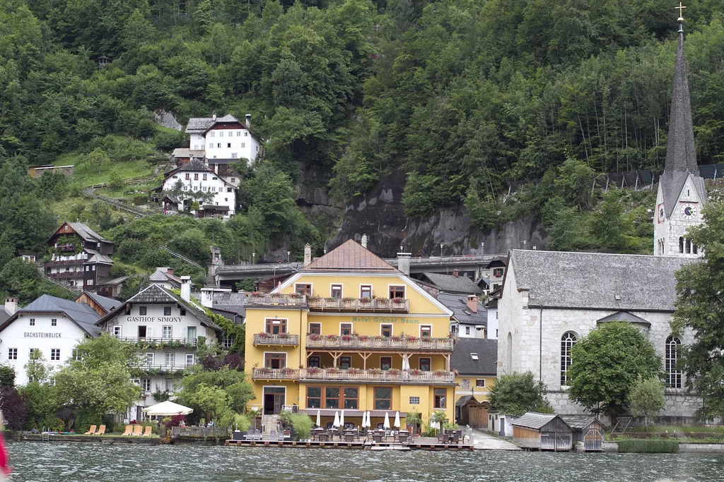 Hallstatt's lakeside houses and church seen from the water.