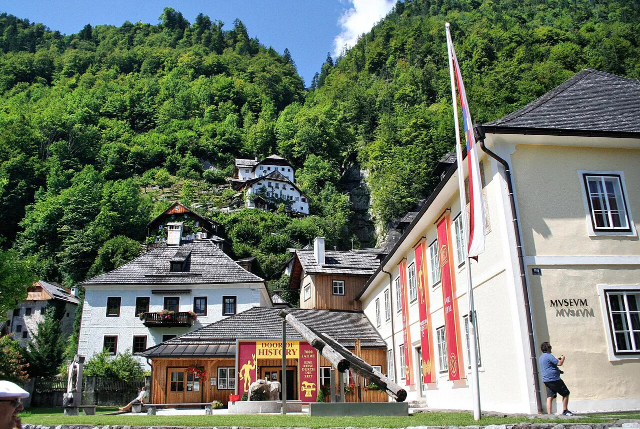 The Museum Hallstatt among the village houses below the wooded slopes.