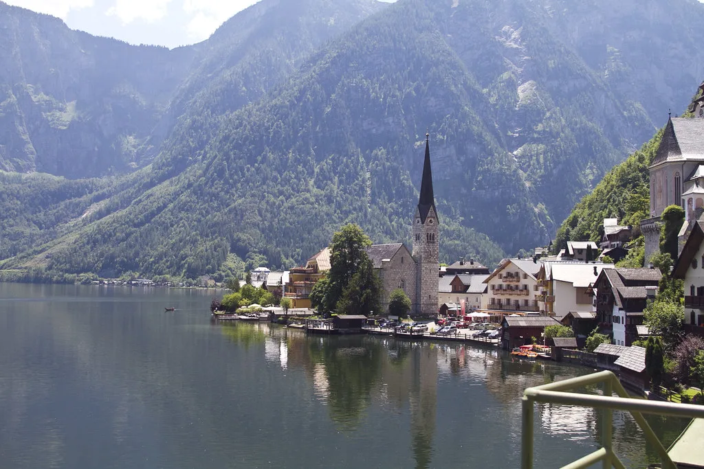 Hallstatt's church spire and lakeside houses seen across Lake Hallstatt.