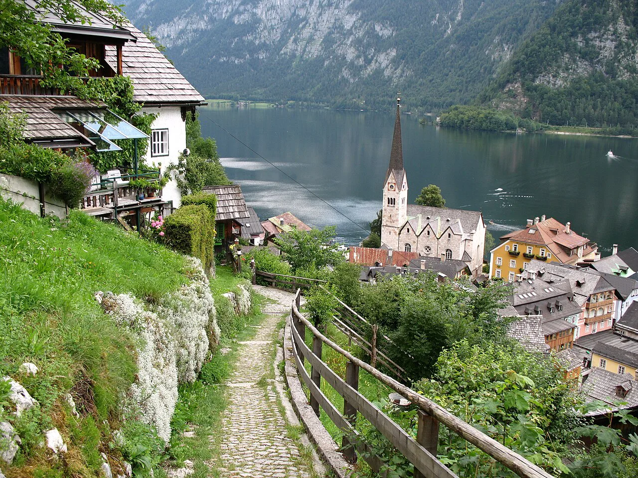 A footpath above Hallstatt looking down on the Lutheran church beside the lake.