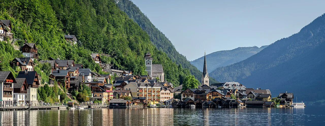 Hallstatt's waterfront and church spires seen from the Hallstätter See.