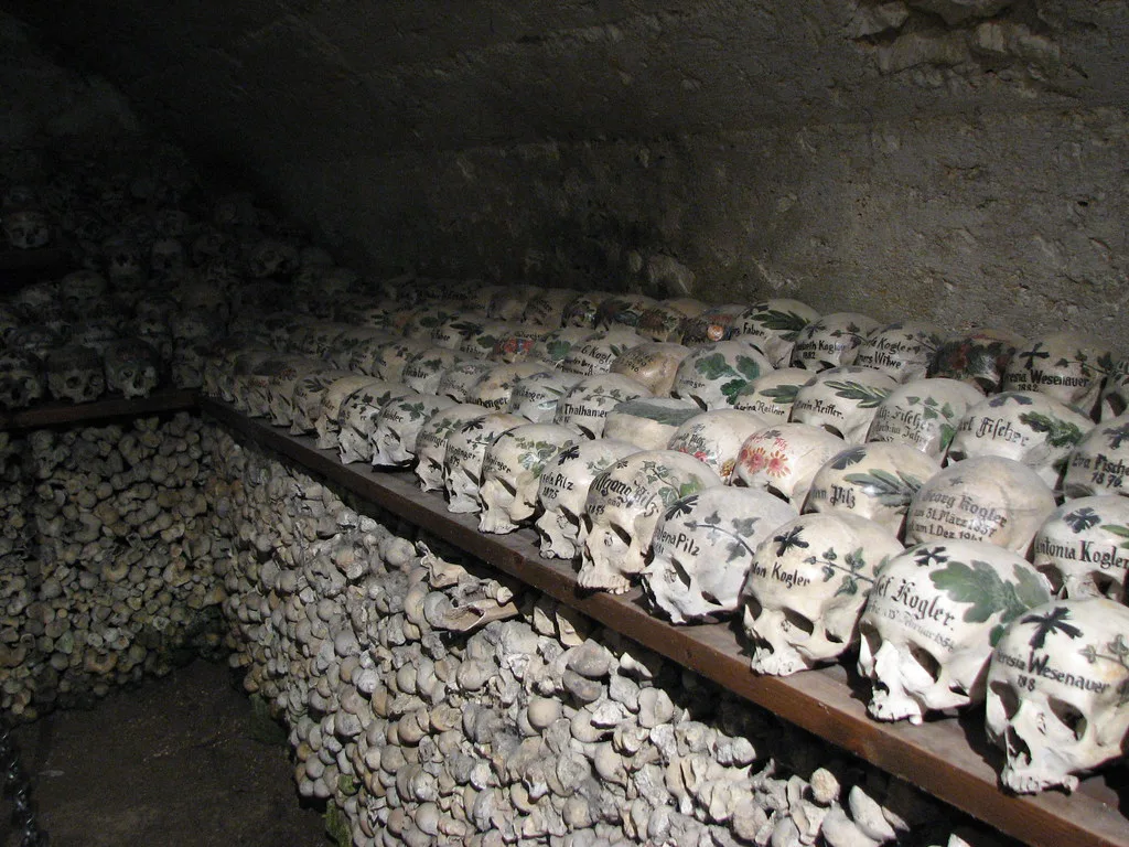 Decorated skulls and bones in the Hallstatt ossuary (Beinhaus) at St. Michael's Chapel, Hallstatt, Austria.