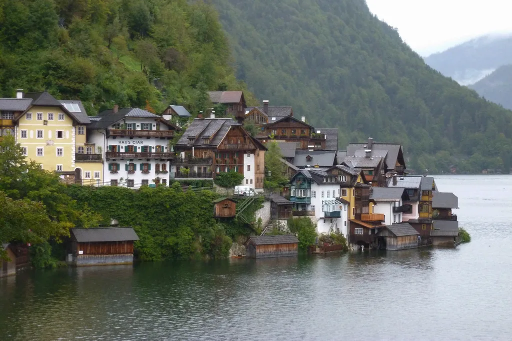 Hallstatt's lakeside houses below steep wooded mountains.