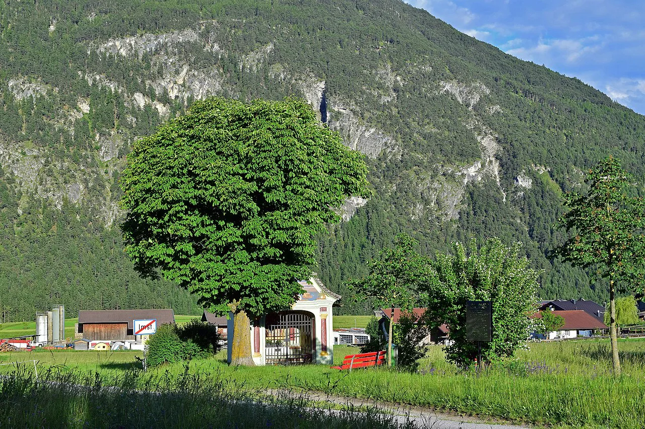 A wayside shrine in Imst with the Tschirgant in the background.