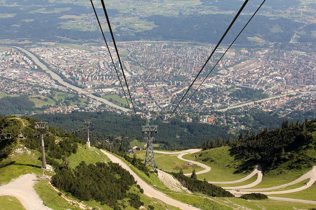 Innsbruck and the Inn Valley in summer, seen from a cable car line above the city.