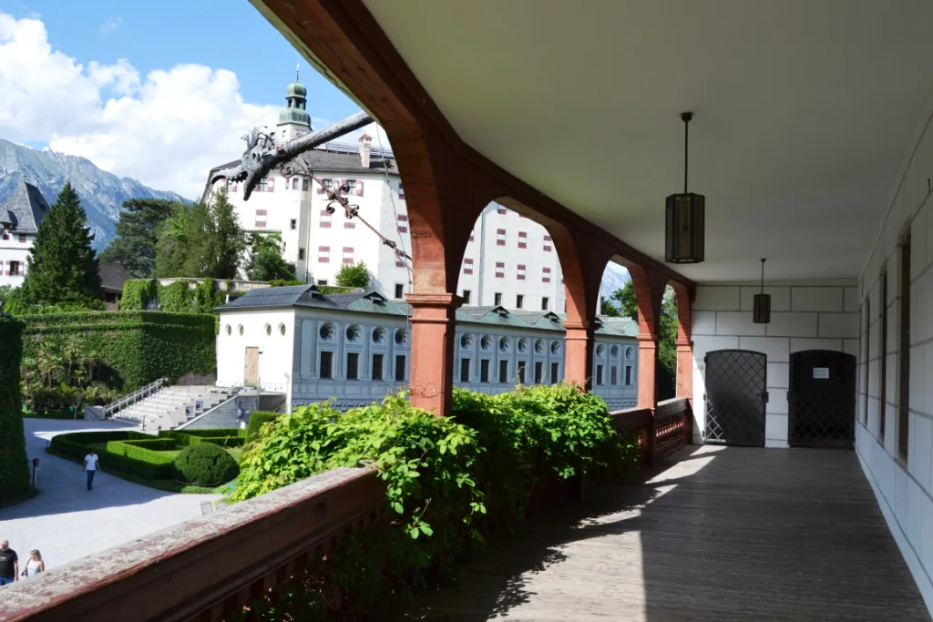 Ambras Castle seen from an arcaded walkway in its gardens, Innsbruck.