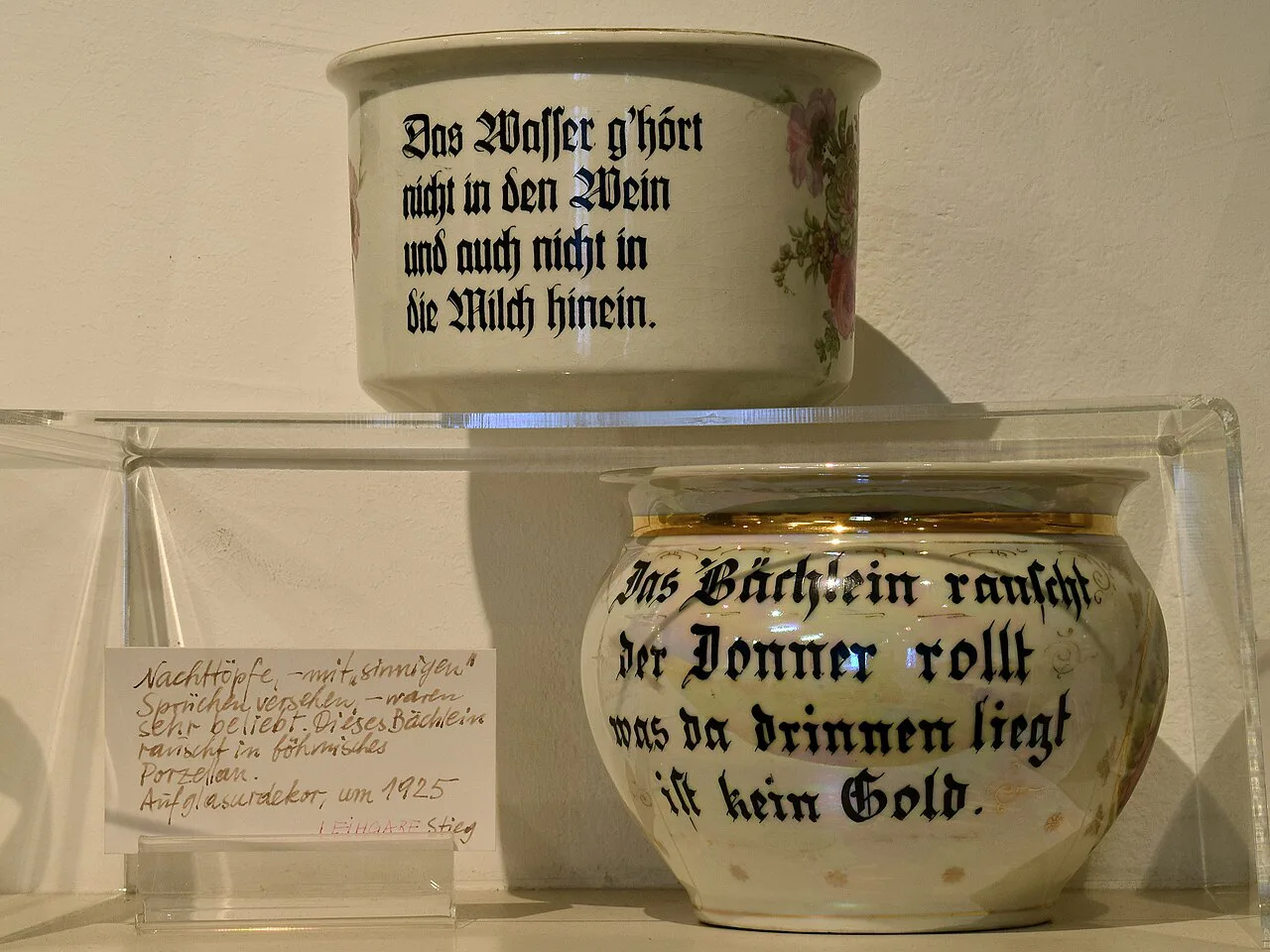 Inscribed chamber pots in the sanitary-ware collection of the Kammerhofmuseum Gmunden.