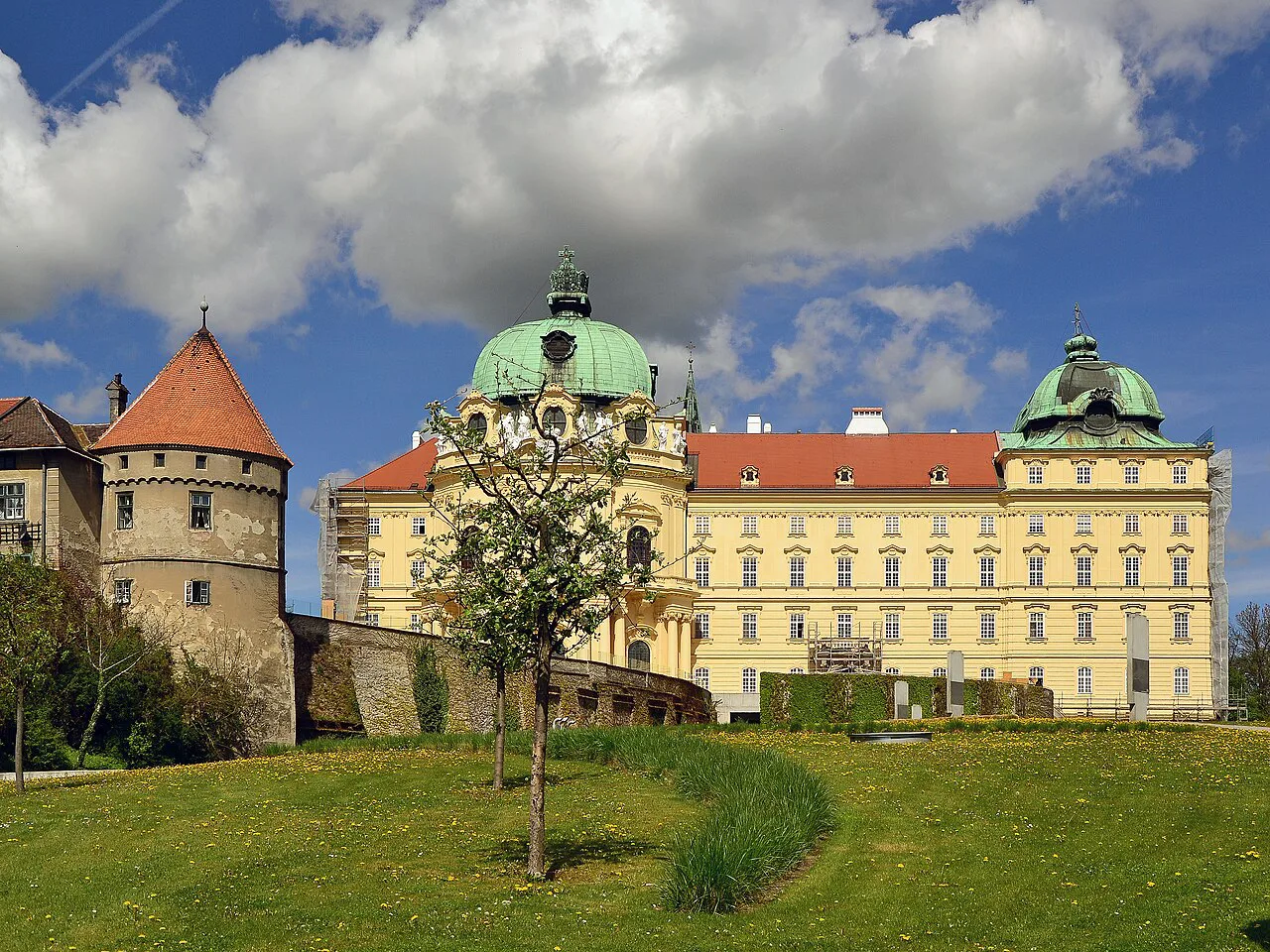 Klosterneuburg Abbey with its green domes and a tower of the old town wall.