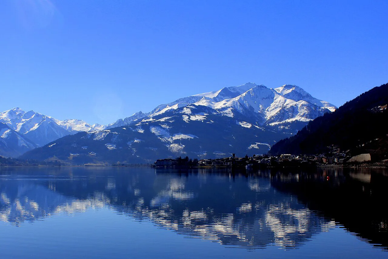 Zell am See and snow-capped peaks reflected in the Zeller See.