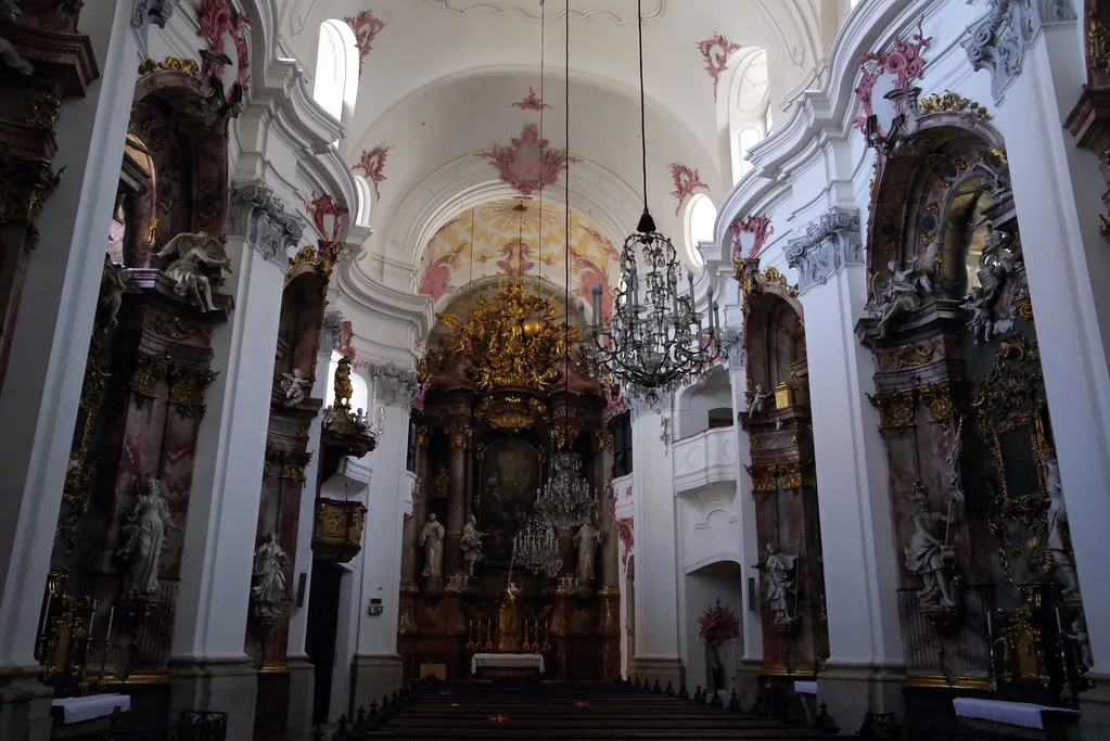 The ornate Baroque interior of a church in Linz.