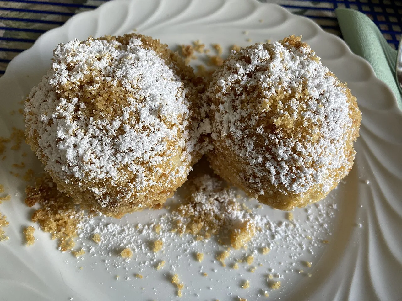 Marillenknödel made with quark dough, rolled in breadcrumbs and icing sugar, in Vienna.