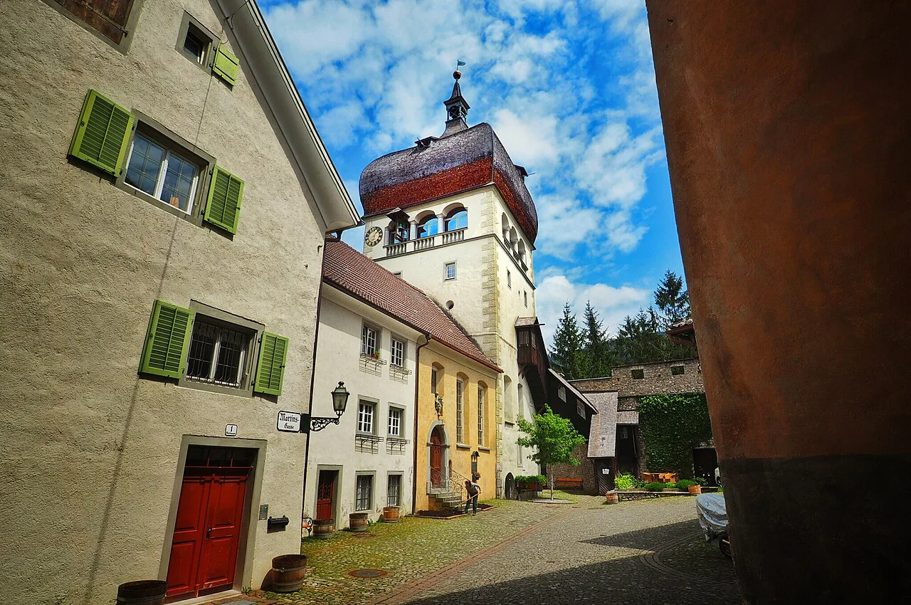 The Martinsturm with its onion dome above a lane in Bregenz's Upper Town.