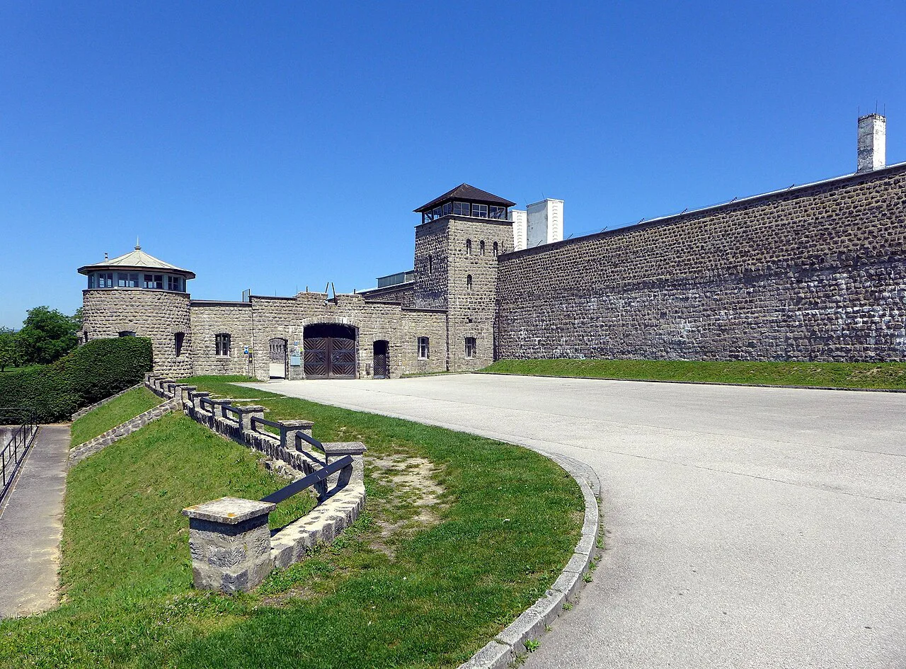 The entrance gateway and stone walls of the Mauthausen memorial.