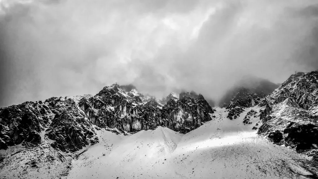 Snowy rock ridges at Hafelekarspitze on the Nordkette, in black and white.