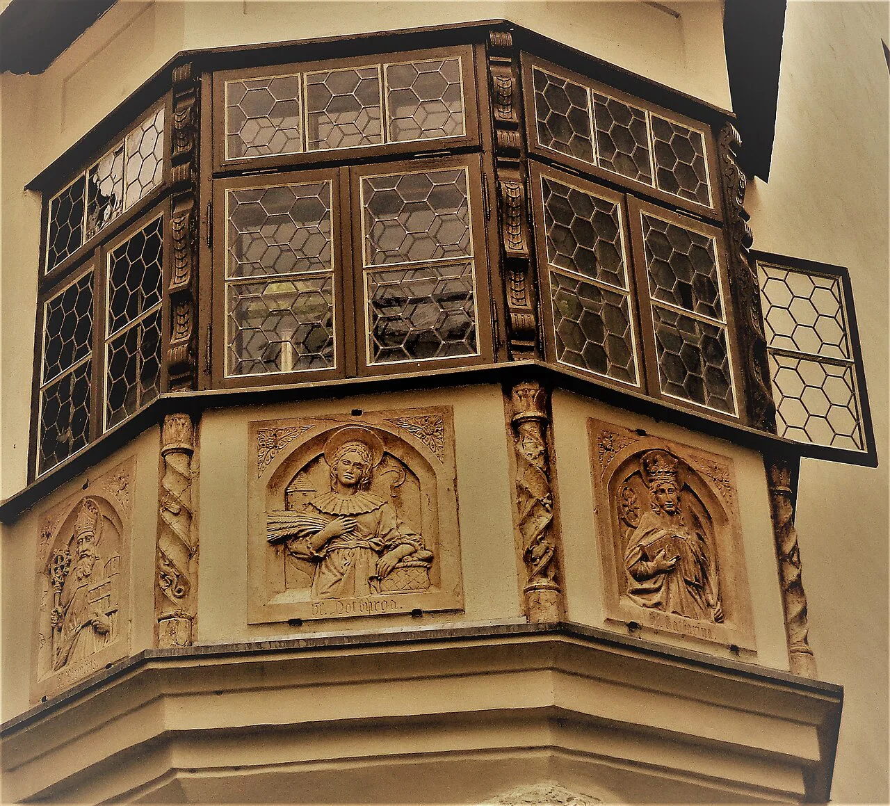 A carved bay window on a house in Rattenberg.