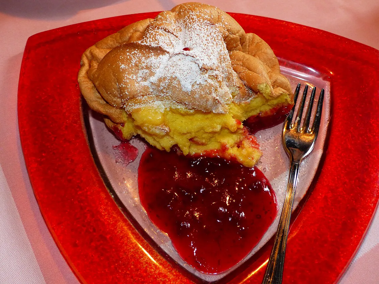 A portion of Salzburger Nockerl with raspberries at a restaurant in Vienna.