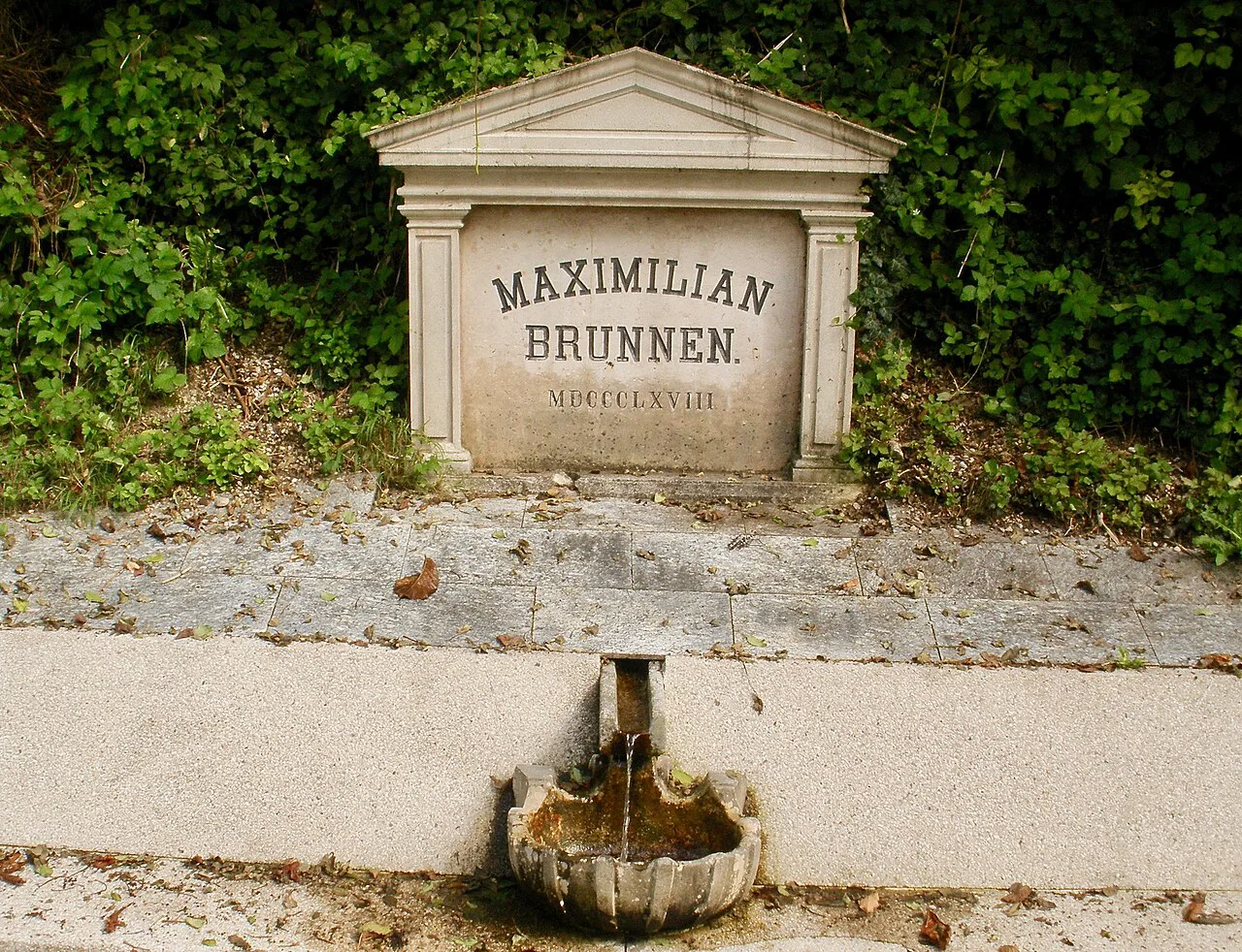 The Maximilianbrunnen fountain on the Traun promenade in Bad Ischl.