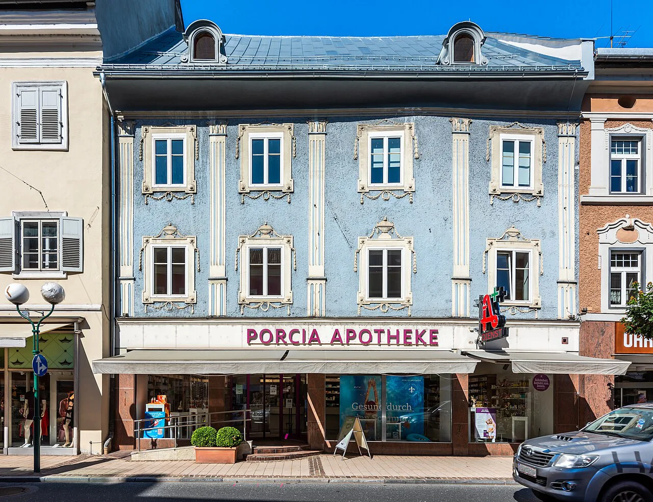 Blue baroque facade of the Moschitz house and pharmacy on Hauptplatz, Spittal an der Drau.