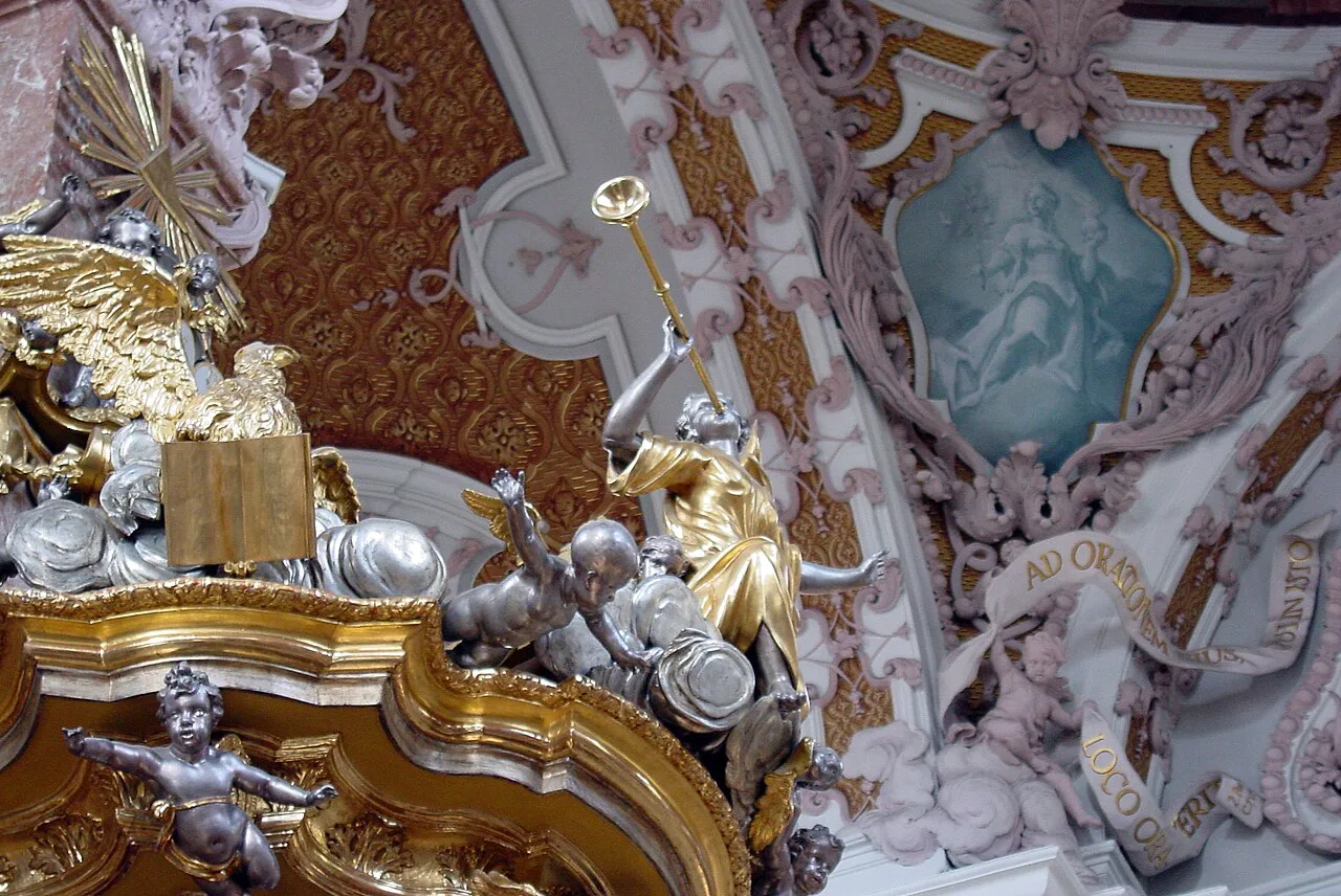 Gilded Baroque stucco and ceiling painting inside St James's Cathedral in Innsbruck.
