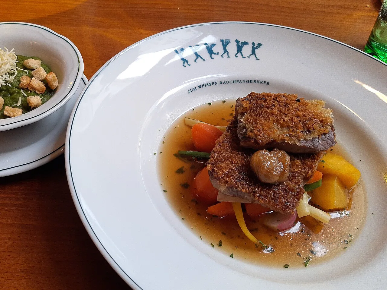 Tafelspitz of veal with root vegetables in broth, served in Vienna.