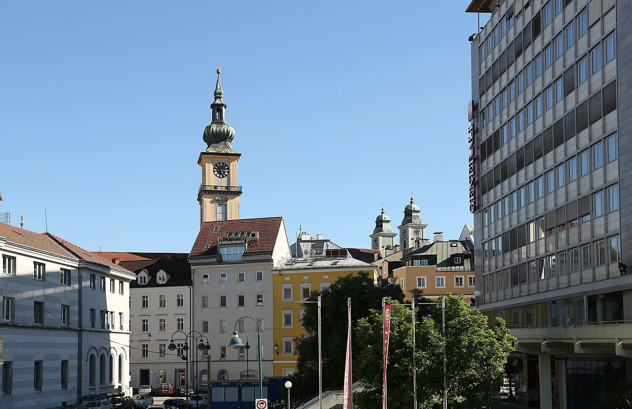 Towers of the Stadtpfarrkirche and the Old Cathedral on the Linz skyline.