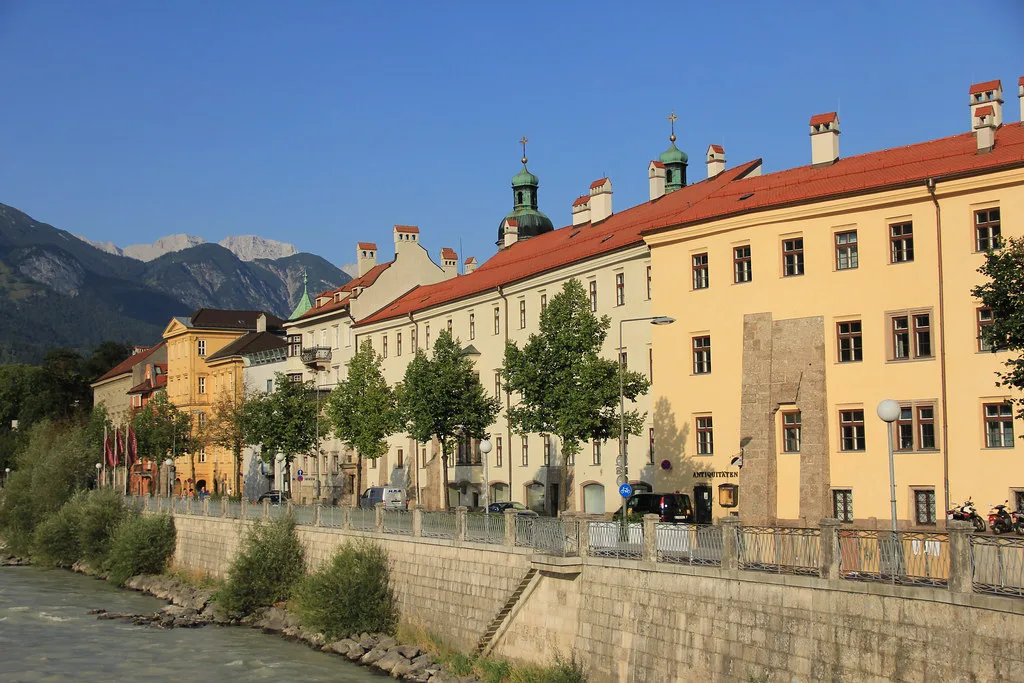 Historic buildings along the Inn river embankment in Innsbruck, Tyrol.