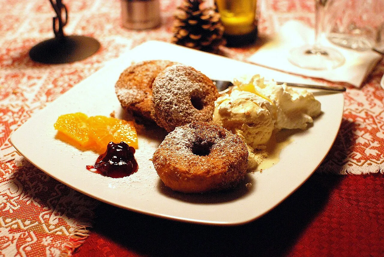 Apfelkiachl, Alpine apple fritters, served with jam, ice cream and cream.