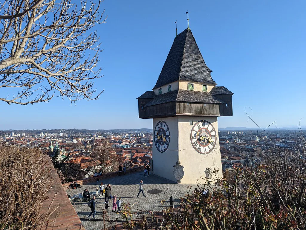 Graz's Clock Tower on the Schlossberg, overlooking the city's rooftops.